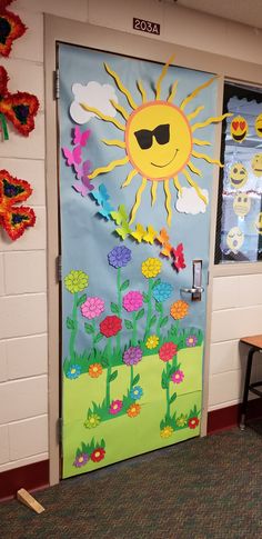 a classroom door decorated with sun and flowers