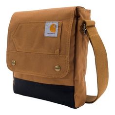 Conquer the day with the Carhartt Legacy Snap Crossbody Bag, the bag that's built strong like you. From work to home and everywhere in between, this bag keeps your hands free to tackle anything that comes your way. It has a large main compartment and a 15 in. laptop sleeve for convenient storage. The bag's water-repellent finish and Carhartt logo complete the design. Perfect companion when extra essentials are needed with you on the go, quick access with easy-access flap Ultra tough 600-denier p Carhartt Bag, Snap Bag, Carhartt Womens, Brown Crossbody Bag, Carhartt Women, Waist Pouch, Brown Crossbody, Work Bags, Carry All Bag