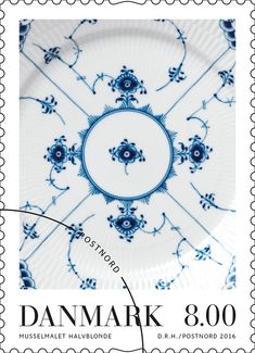 a stamp with a blue and white design on it's front, in the shape of a plate