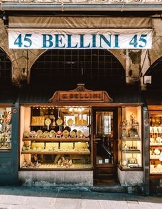 a store front with an awning that says, 45 bellini 45 on it