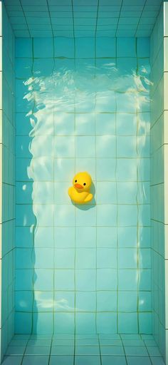 a yellow rubber duck floating in a blue swimming pool with tiled walls and flooring