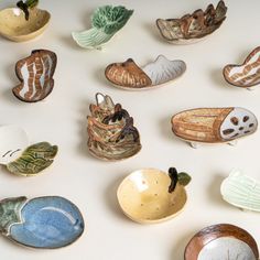 a collection of ceramic bowls with designs on them