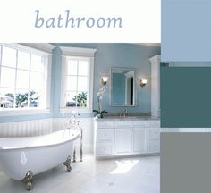 a bathroom with blue walls and white fixtures