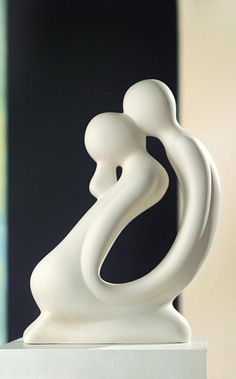 a white sculpture sitting on top of a table