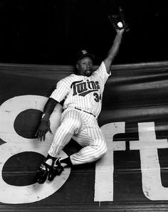 a black and white photo of a baseball player