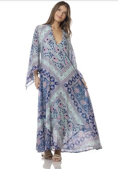 Indulge in the ethereal beauty of our Audrey Maxi Dress with Butterfly Sleeves in Blue. This stunning piece is crafted from 100% Indian cotton, making it soft and comfortable against your skin. The intricate butterfly sleeves add a touch of whimsy and romance, making you feel like a true goddess. The dress features a beautiful blue print that will transport you to a dreamy paradise. The flowy maxi length adds a touch of elegance and grace to your every step. Whether you're strolling along the be Blue Breezy Flowy Cover-up, Blue Flowy Breezy Cover-up, Hippie Beach Cover-up Dress With Kimono Sleeves, Fitted Bohemian Blue Cover-up, Blue V-neck Festival Cover-up, Flowy Wrap Beach Dress, Hippie Blue V-neck Dress, Light Blue Maxi Dress For Beach Cover-up In Spring, Spring Flowy Maxi Cover-up