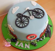 a birthday cake with a bicycle on it