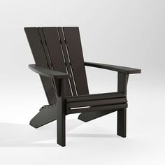 a black wooden chair sitting on top of a white floor