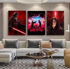 three star wars paintings on the wall in a living room with couches and chairs