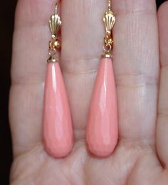 HAND MADE 14K GF ANGEL SKIN PINK CARVED MOLDED CORAL LEVER BACK TEAR DROP EARRINGS VINTAGE  GORGEOUS  HAND MADE  PAIR OF 14K  GOLD FILLED  SYNTHETIC  FACETED CARVED CORAL                        QUALITY CARVED ANGEL SKIN CARVED SYNTHETIC CORAL  LARGE 52 MM FACETED ANGEL SKIN CORAL DROP EARRINGS  A  SIMULATED CARVED CORAL MOLDED CORAL DROP:   30MM X 10MM FROM TOP TO BOTTOM:  52 MM VINTAGE 1950'S SYNTHETIC CORAL / HAND MADE  EARRINGS SEE PHOTOS I INCLUDED MANY PHOTOS OF THESE CARVED MOLDED CORAL CO Coral Drop Earrings, Angel Skin, Tear Drop Earrings, Earrings Vintage, How To Make Earrings, Coral Color, Tear Drop, Teardrop Earrings, Vintage Earrings