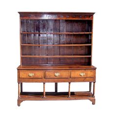 an old wooden bookcase with two drawers