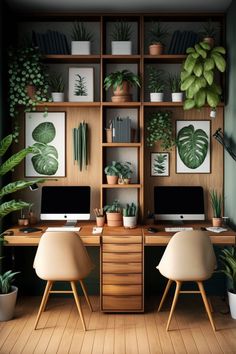 a desk with two computers on top of it next to potted plants and bookshelves