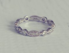 a white gold wedding band with diamond accents