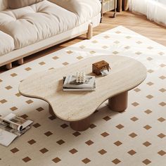 a coffee table sitting on top of a white rug