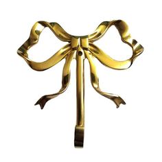 a gold bow on a white background is shown in this image, it appears to be made out of metal