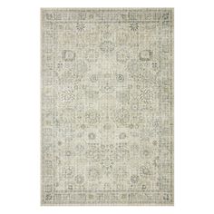 a rug with an ornate design on the top and bottom, in light green tones