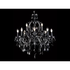 a crystal chandelier with many lights on it's sides and black background