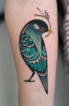 a colorful bird tattoo on the right arm and leg with an arrow in it's beak