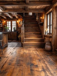 an old log cabin with wood floors and stairs