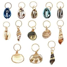 a bunch of different types of seashells on key chains