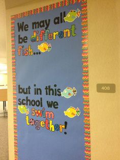 a bulletin board that says we may all be different but in this school we swim together