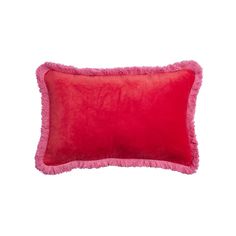 a red pillow with pink fringe on the bottom and side, against a white background