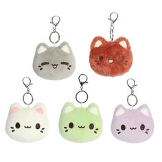 four key chains with different colored cats on them