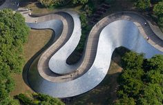 an aerial view of a skate park in the woods