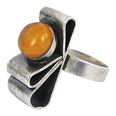 Beautiful Polish vintage silver ring shaped as a ribbon with amber cabochon. Condition: Very good preowned condition. Creator: - Materials and Techniques:  Silver Marks:  Warsaw silver hallmark and makers mark. Date (~): 1960's Place of Origin:  Poland Measurements: 2,7x1,1 cm, Size 18,5 cm / size 58, Weight 9 g Vintage Silver Ring, Ribbon Ring, Amber Bead Necklace, Amber Resin, Vintage Silver Rings, Amber Ring, Ring Shapes, Amber Beads, Silver Brooch