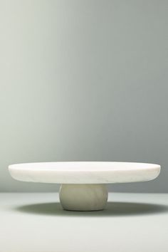 a white plate sitting on top of a table