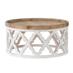 a round wooden tray with an intricate design on the top and bottom, sitting on a white background