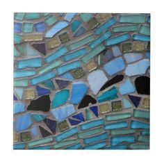 an image of blue and green mosaic tiles