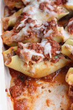 stuffed shells with meat and sauce in a casserole dish