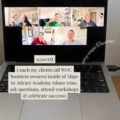 an open laptop computer sitting on top of a wooden table next to a sign that says coach my clients all woc business owners inside of align