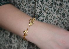 This dainty and intricate floral branch bracelet consists of a swirly branch like design loaded with lots of little forger-me-not flowers. It has two branches loaded with lots of lovely flowers growing out of each side. It has a tiny little pearl in the center of each flower.The metal base is flexible so it is very easy to adjust it to the wrist for a comfortable fit. * Comes wrapped in a beautiful gift package.* Could be requested in either 14k gold, rose gold or silver plated brass.For updates, new products, one-of-a-kind's, special offers and more- like me on Facebook:https://www.facebook.com/avigailadamjewelleryFollow me on instagram: http://instagram.com/avigailadamjewelry/ Gold Flower Bracelet, Branch Bracelet, Hair Chains, Floral Branch, Gold Wrap, Floral Bracelet, Jewelry Bridesmaid, Bohemian Bracelets, Gift Package