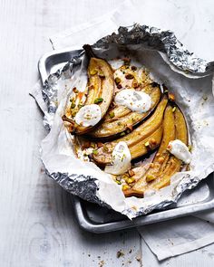 some food is sitting on top of tin foil in a pan and ready to be eaten