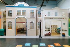 a large doll house on display in a building