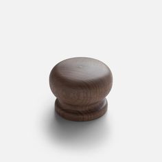 a wooden knob on a white background