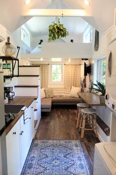 the interior of a tiny home with wood flooring