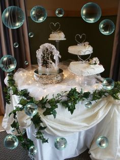 a table topped with lots of cake covered in bubbles