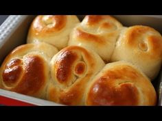 several hot cross buns in a red box