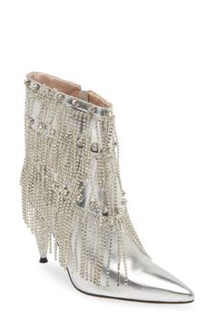 Swaying fringe animates a glam bootie punctuated by glistening rhinestone studs in a tiered formation. 4" heel (size 8.5) 6" shaft Side zip closure Arch support Synthetic upper, lining and sole Imported Asian & Pacific Islander Owned/Founded Elegant High Heel Boots With Rhinestone Fringe, Glamorous Rhinestone Fringe Boots For Night Out, Glamorous Embellished Boots For Party Season, Glamorous High Heel Boots With Rhinestone Fringe, Elegant Silver Boots With Rhinestone Fringe, Chic Fringe Boots For Party, Pointed Toe Party Boots With Fringe, Party Boots With Fringe And Pointed Toe, Silver High Heel Boots With Rhinestone Fringe