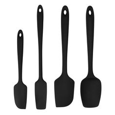 three black spatulas with handles on each side and two spoons in the middle