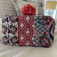 New With Tags Enjoy This Cute Boho Anthropologie Clutch Or Crossbody. Made Of Three Different Fabrics And A Big Pom-Pom Topper. They Have Woven A Few Beads Throughout The Fabric. For Fall Football Games Or Any Upcoming Event, It’s A Showstopper This Includes A Little Pouch Of Beads In Case One Of Them Falls Off The Chain Can Be Tucked Inside Or Worn Crossbody. Anthropologie, Patchwork, Boho Clutch, Anthropologie Bags, Fall Football, Football Games, Upcoming Events, Different Fabrics, Pom Pom