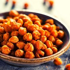 a bowl filled with chickpeas sitting on top of a table