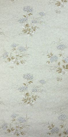 an old wallpaper with blue and white flowers on it