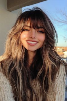 Click for More ➡️ | Save for Later ❤️  A vibrant ombre effect transitions from deep red to fiery orange and ends in golden yellow, resembling a sunset. The wispy bangs add a light, airy touch to this otherwise bold and colorful style. (Sunset Ombre with Wispy Bangs - Long Layered Hair With Bangs) Fall Hair Looks For Brunettes, Cute Front Bangs, Long Ombre Hair With Bangs, Curtain Bangs On Long Face, Butterfly Haircut Wispy Bangs, Bangs With Extensions, Fairy Bangs Hair, Long Bangs Layered Hair, Hair Inspo Bangs And Layers