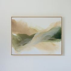 an abstract painting hangs on the wall