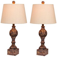 Set of 2 lamps. Each is 26 1/2" high overall. Bases are 4 1/2" square. Shades are 10" wide at the top x 13" wide at the bottom x 9 1/2" high. Each uses one maximum 100 watt standard-medium base A19 bulb (not included). On-off socket switches. Traditional style, sculpted column table lamps. Distressed cottage antique brown finishes. Cast resin construction. Oatmeal linen shades. 7-foot long cords.  Ornate design elements add a fresh touch to this gorgeous table lamp set. Given a rich finish in distressed cottage antique brown, it offers an aged look and feel. This set of two antique brown sculpted table lamps rounds out a beautifully designed traditional space. Brown Lamps, Column Table, Luxury Lamps, Designer Shades, Linen Lights, Lamp Set, Table Lamp Sets, Antique Lamps, White Table Lamp