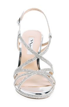 Sparkling rhinestones add eye-catching glamour to a slingback sandal set on a subtle platform and tapered heel. Adjustable slingback strap with buckle closure Synthetic upper and lining/leather sole Imported Formal Strappy Sandals With Rhinestones, Glamorous Rhinestone Slingback Sandals, Glamorous Slingback Sandals For Events, Glamorous Slingback Sandals With 4-inch Heel, Party Slingback Sandals With Rhinestones, Glamorous Silver Slingback Sandals, Glamorous Embellished Slingback Sandals, Silver Synthetic Slingback Sandals For Party, Glamorous Slingback Sandals With Heel Strap